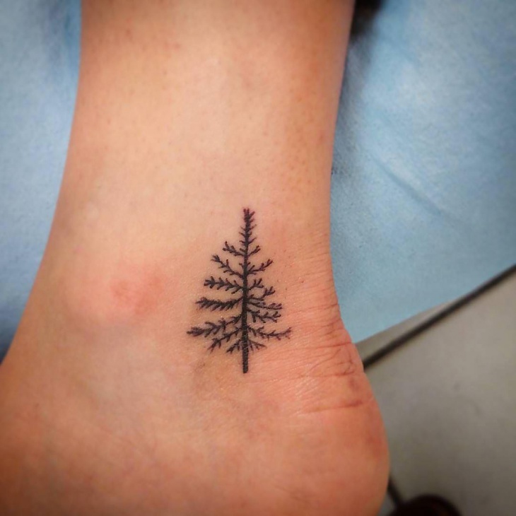 small tree tattoo on ankle