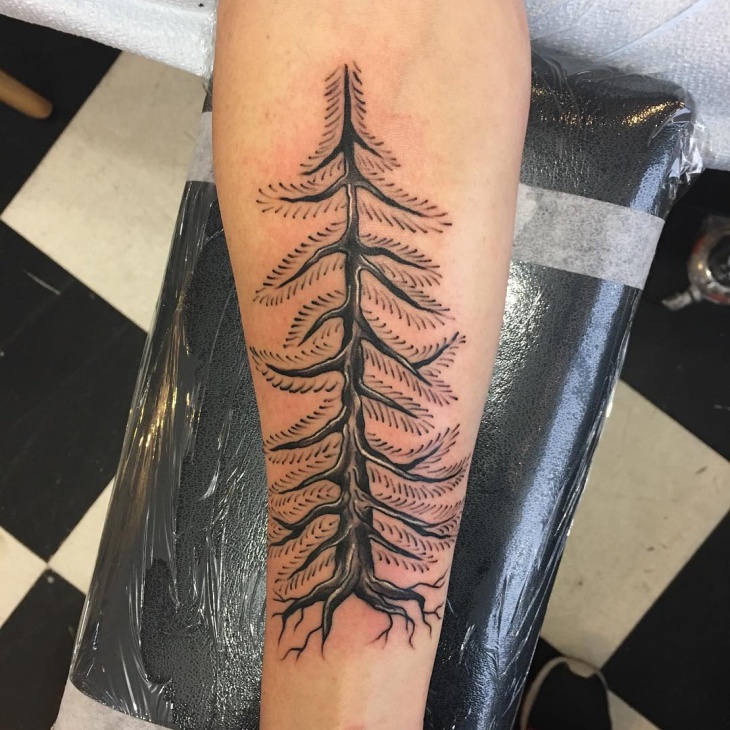 pine tree wrist tattoo