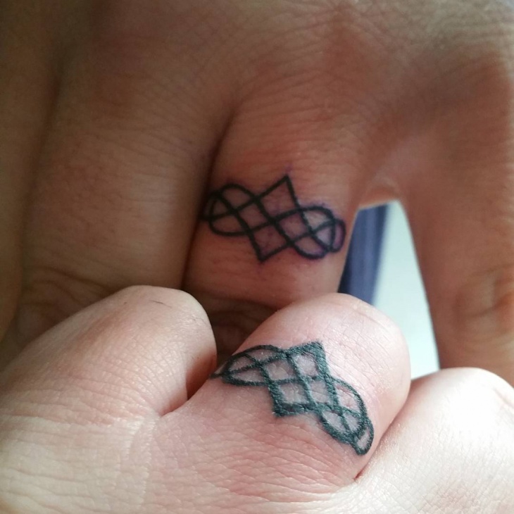 infinity symbol finger tattoo