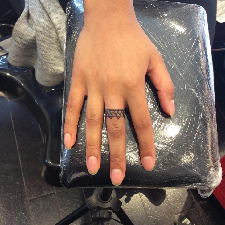 tribal middle finger tattoo