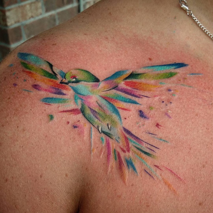 watercolor bird tattoo on shoulder