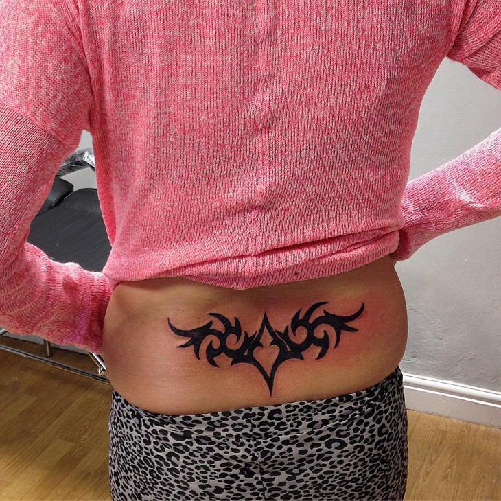 female lower back tattoo design