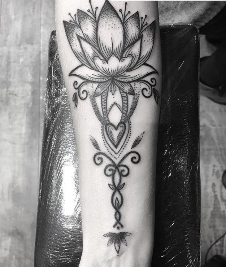 black and white lotus flower tattoo on wrist