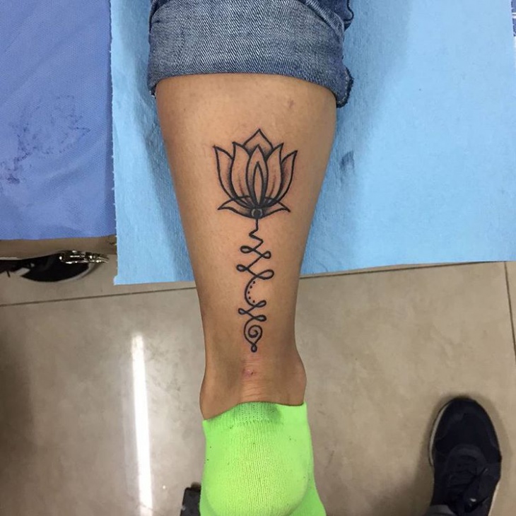 closed lotus flower tattoo on leg