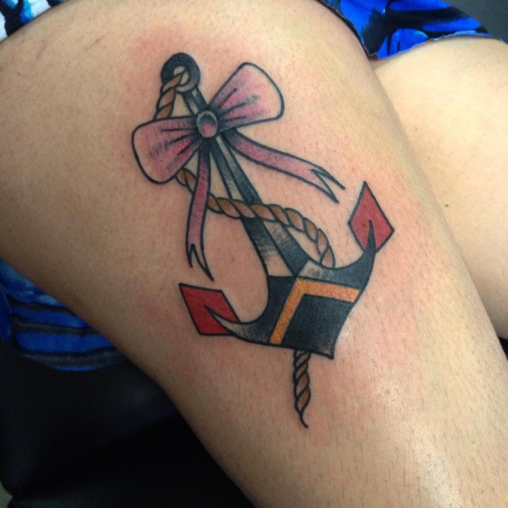 anchor with bow tattoo on thigh