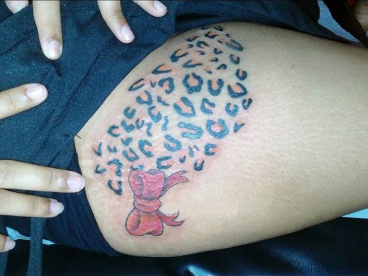 leopard print thigh tattoo
