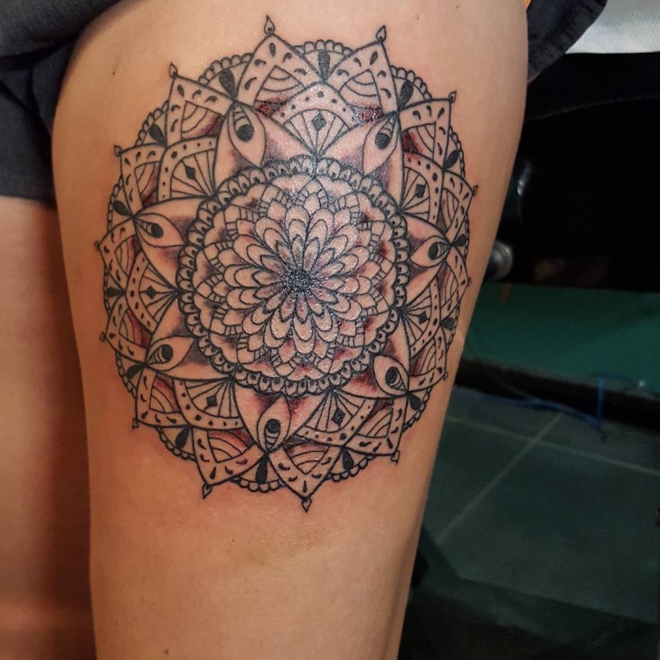 polynesian thigh flower tattoo for men