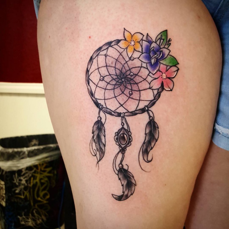 dreamcatcher flower thigh tattoo