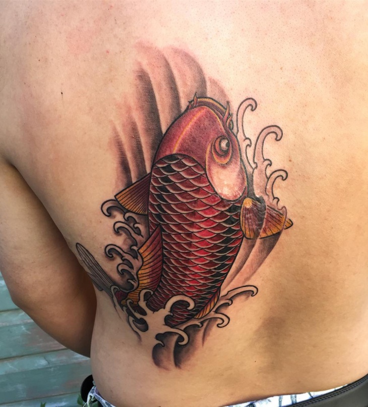 red koi fish tattoo on back