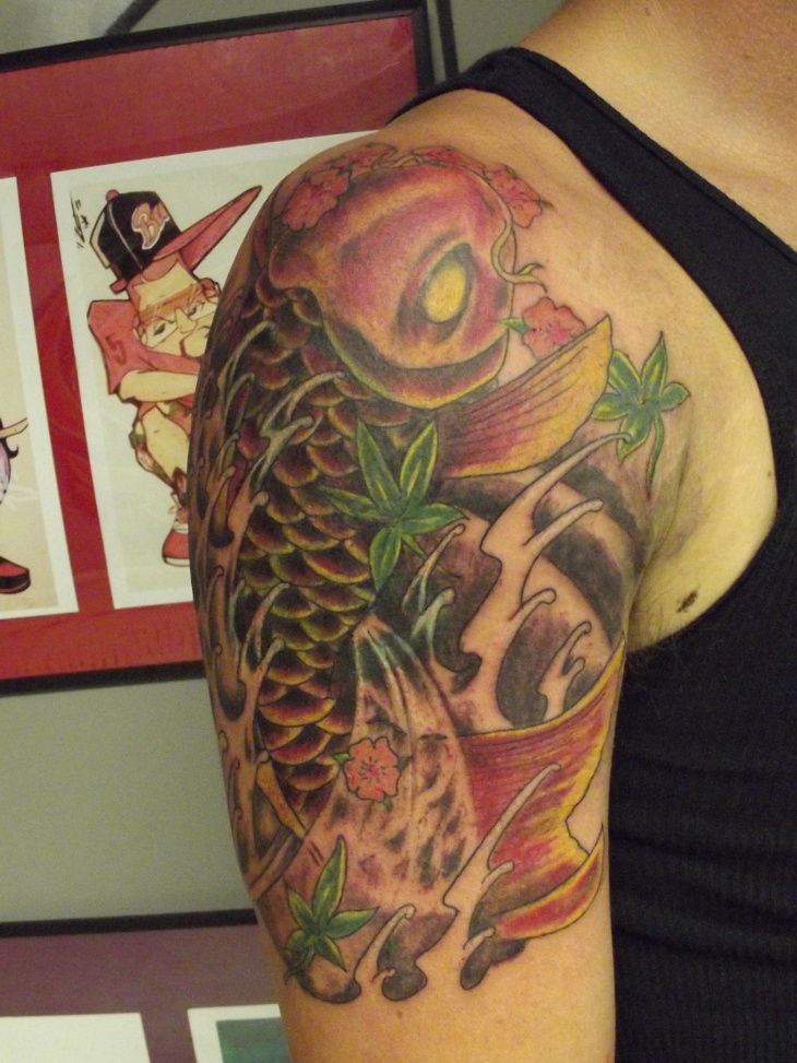 evil koi fish tattoo on sleeve