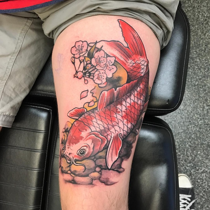 koi fish and flower tattoo on thigh