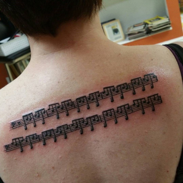 sheet music tattoo for back