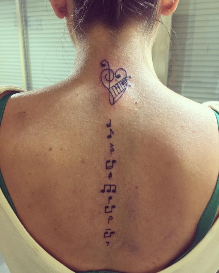 music tattoo on back neck