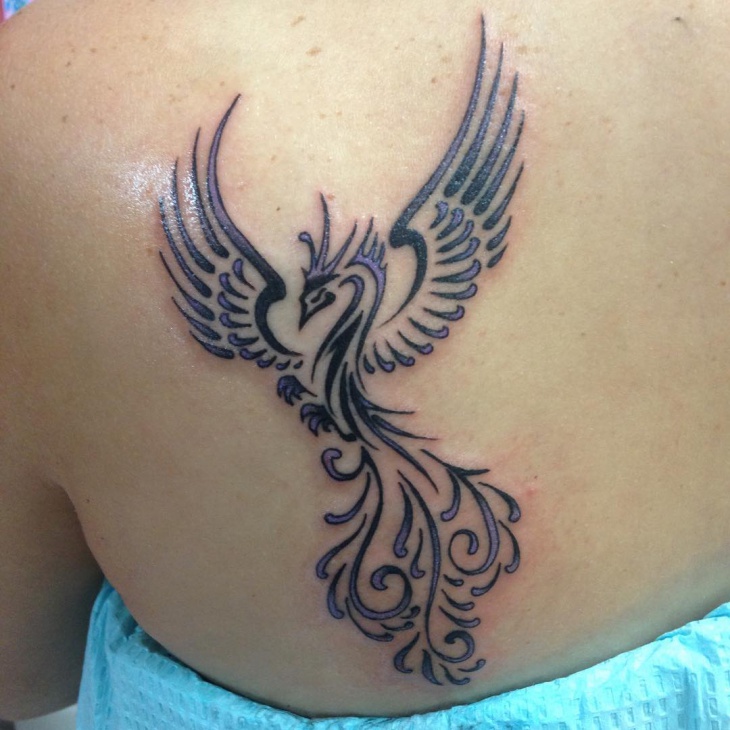 tribal phoenix tattoo on back