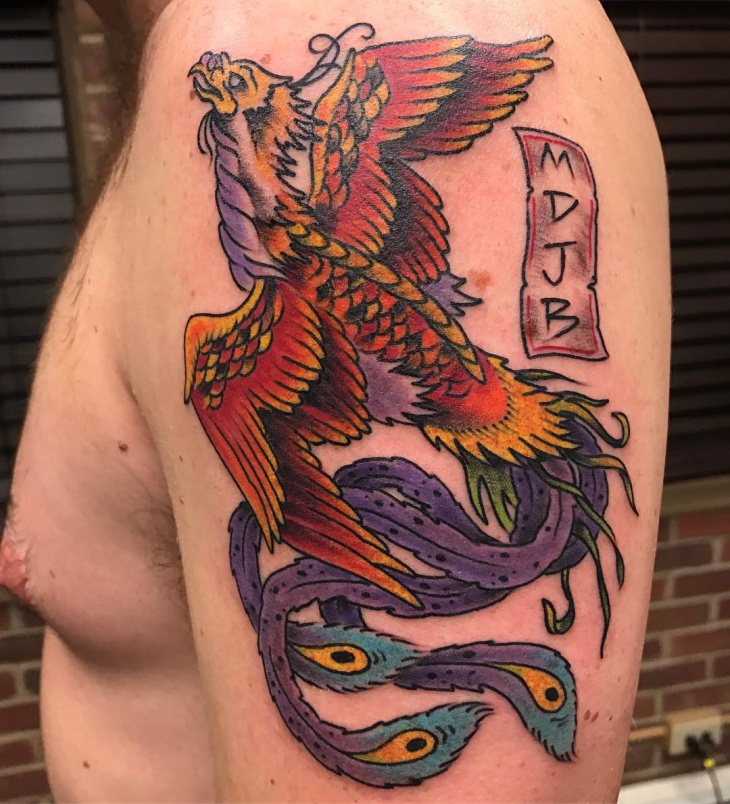 rising phoenix tattoo on sleeve