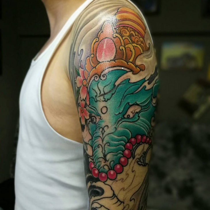 colorful dragon tattoos on arm