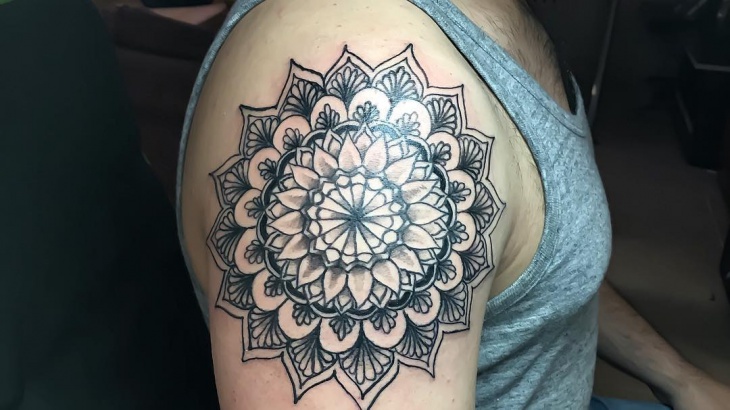geometric mandala tattoo on sleeve