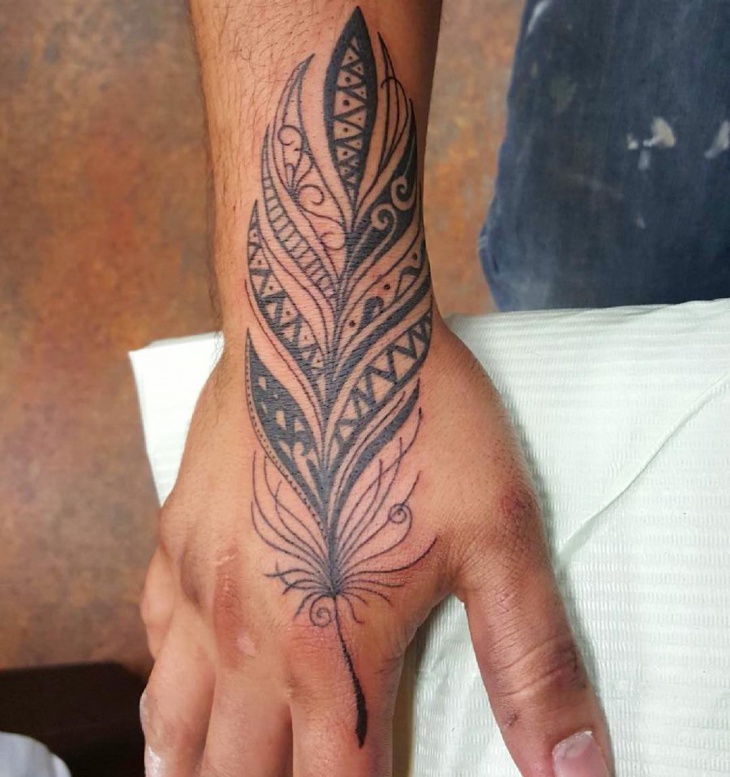 mandala feather tattoo on hand