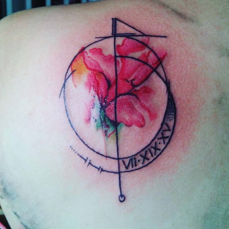 watercolor geometric tattoo on shoulder