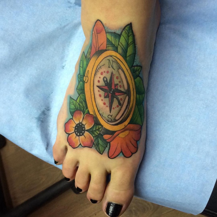 traditional compass tattoo on foot