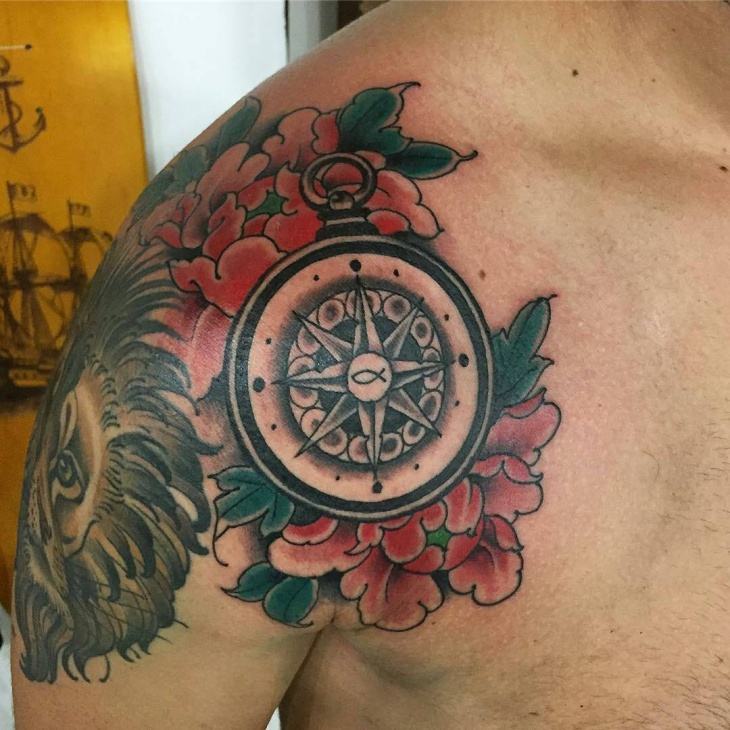 compass flower tattoo on shoulder
