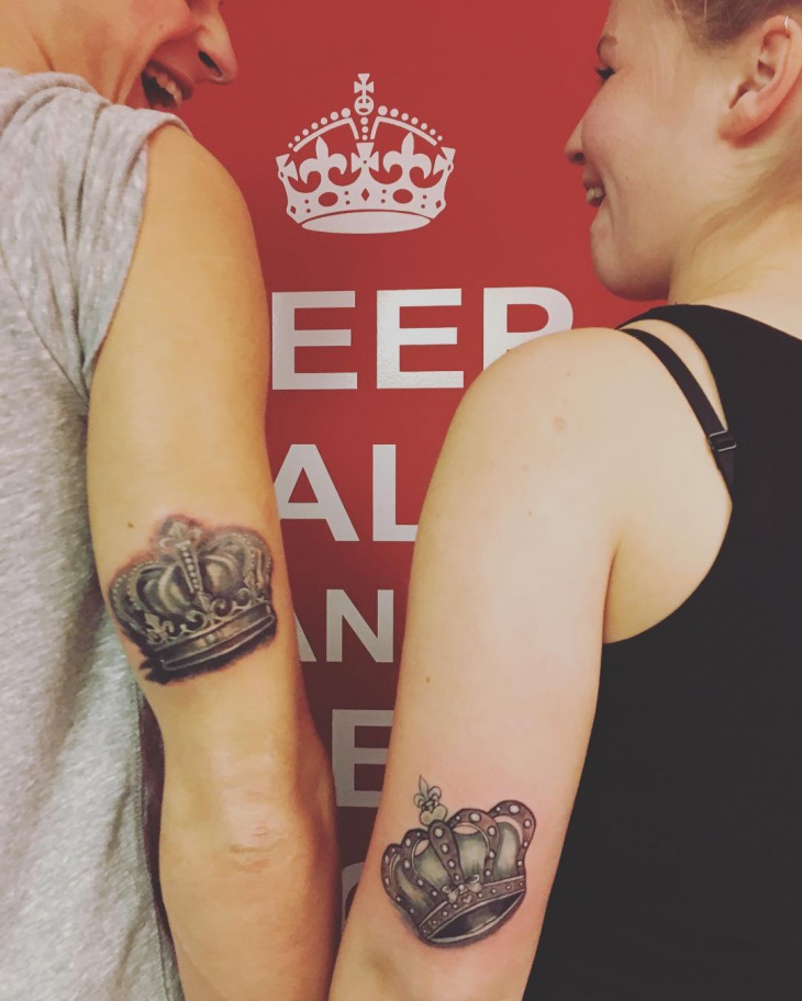 matching crown arm tattoo