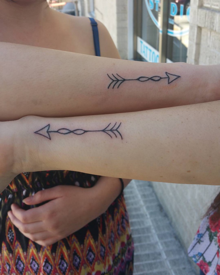 matching sister arrow tattoo