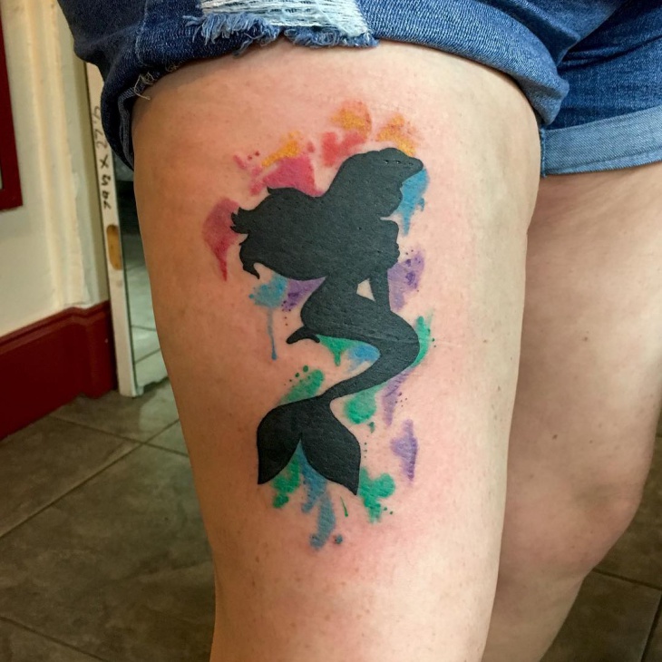 little mermaid tattoo on thigh