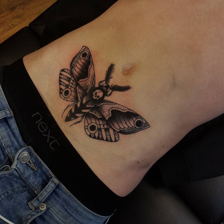 small butterfly stomach tattoo