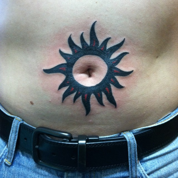 tribal stomach sun tattoo