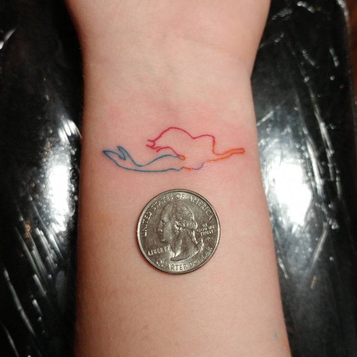 simple mermaid wrist tattoo design