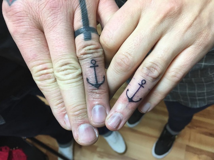 couple anchor tattoo on finger