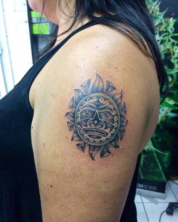 aztec sun tattoo on shoulder