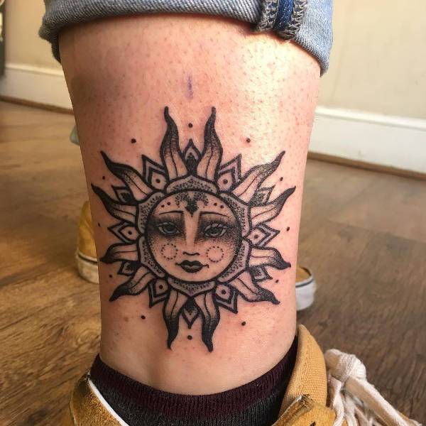 vintage sun ankle tattoo