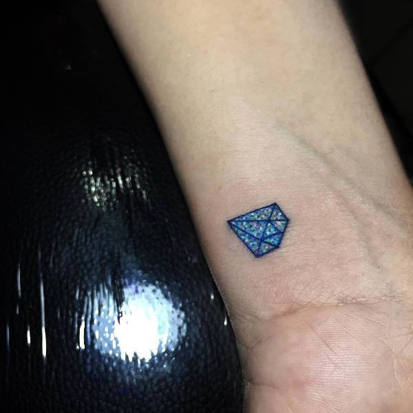 small diamond tattoo on wrist