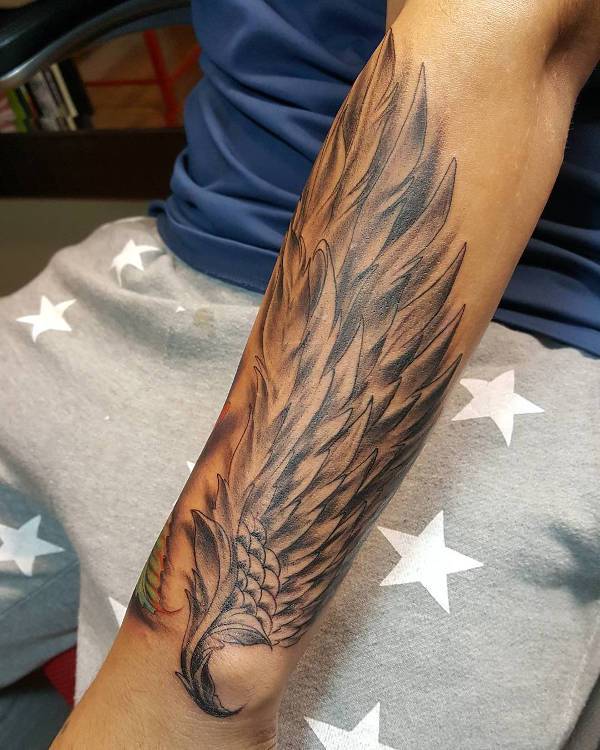 angel wing tattoo on hand