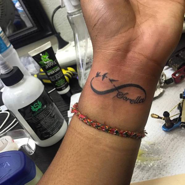 small infinity tattoo for men on wrist