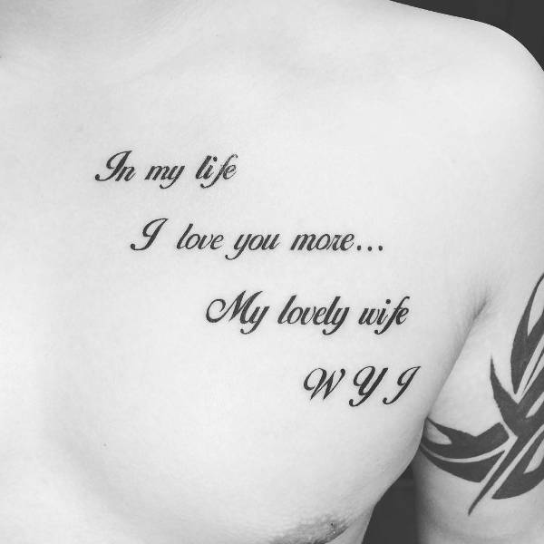 love quote tattoo on chest
