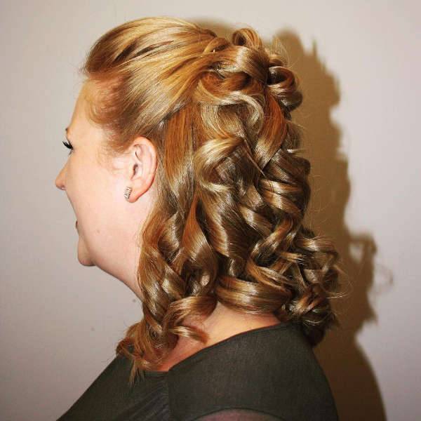 curly half up half down hairstyle